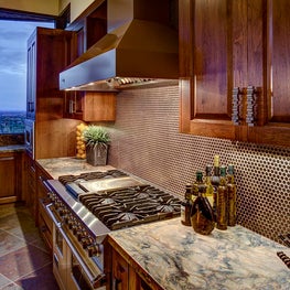 The hand applied texture and finish on the cabinetry was inspired by the natural outdoor beauty.