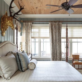 Master bedroom reflects a sophisticated country retreat