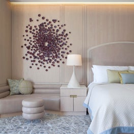 Cosmopolitan of Las Vegas - bedroom with banquette & custom ceramic artwork 