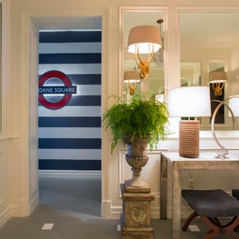 Glamorous Mirror Paneled Entry with Peak of London-Inspired Tube Sign
