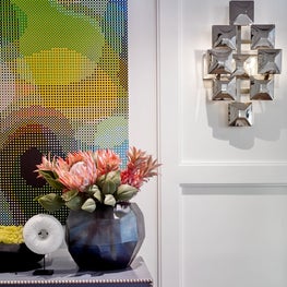 Lavender console with metal rivets and metallic sconces