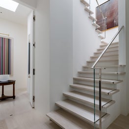 A floating modern stair to a roof garden