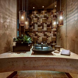 Specifying a contemporary sink and ceiling mount fixtures add a modern touch