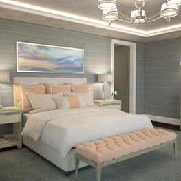 Wall art depicting soft pink and blue sunset hues inspires the color palette.