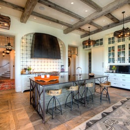 White Oceanfront Kitchen with Reclaimed Beams, Steel Island & Hood