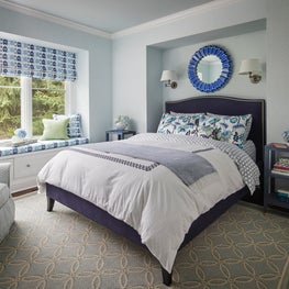 Glenview Bedroom. Navy and blue bedroom with Ikat printed shades/window seat & botique, small print wallcovering.