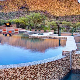 Reflecting the beauty of the scenery, this outdoor patio design artfully connects to nature