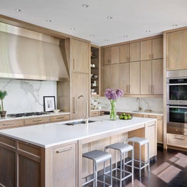 Kitchen, Light Brown Wood Cabinets, Quartz Island, Six-burner Cooktop, Miele Appliances, Emeco Chairs - Glencoe Contemporary Project