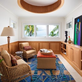 A bohemian blend of tribal motifs and organic materials complement this space.