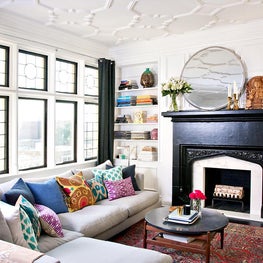 Black and White Pied a Terre with custom ceiling, fireplace, and colorful rug