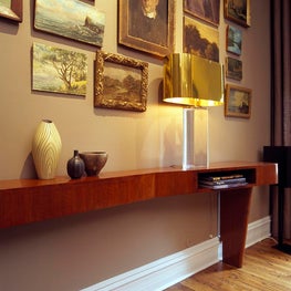 Italian mahogany console table with a lucite & brass lamp