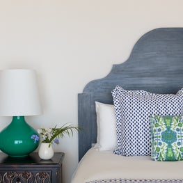 Bright bedroom blending the nature of the seaside with the indoors.