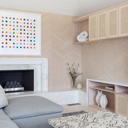 Portfolio: A Damien Hirst painting over a fireplace with custom millwork in Pebble Beach, CA.
