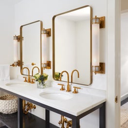 Hamptons Master Bathroom with black and white console and brass fixtures