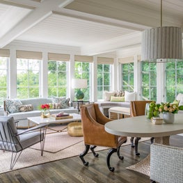 Well Lit Open Living and Dining Area, with Large Green Lamps and Oval Table
