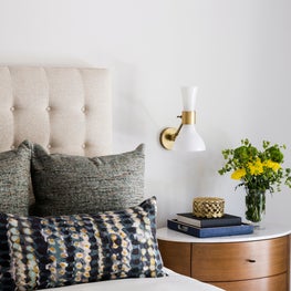 Portfolio: Guest bedroom with a tufted headboard and acorn colored nightstand
