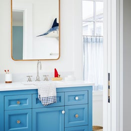 Boys bathroom with blue vanity
