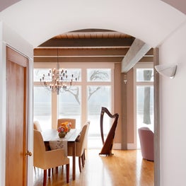 Lake Michigan Hall. Arched entry to dining area with 2097 chandelier, harp & planked and beamed ceiling.