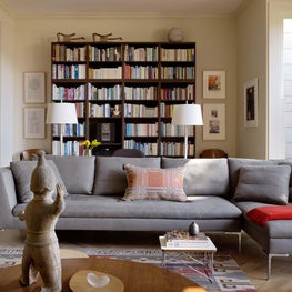 Living room with shelving and warm accents