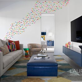 With fun elements, pops of color, durable furnishings and performance fabric, this pool house design is perfect for kids and guests.