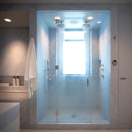 Master Bathroom in NYC apartment, with double shower heads, and marble