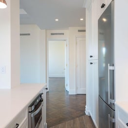 Open White Kitchen with Custom Cabinetry