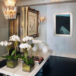 Intimate hallway with mirrored wall