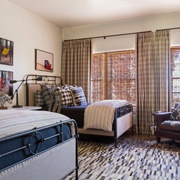 Vintage inspired beds layered in native American prints and plaids