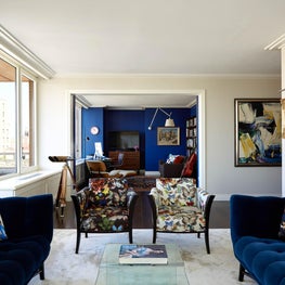 Mid century inspired living room with royal blue accents
