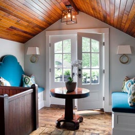 Upstairs Sitting Area with Wood Ceiling Detail and Built-In Benches