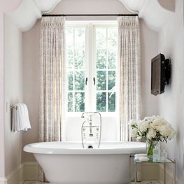 Authentic master bath with free-standing tub, marble floors