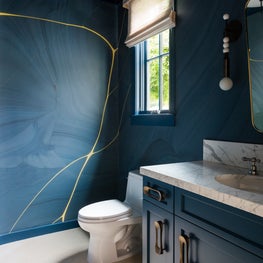 Portfolio: A powder room with a deep marine blue Flavor Paper mural in Pebble Beach, CA.