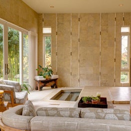 Custom designed stone walls with vertical inset accents of tile and stone