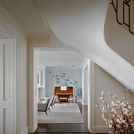Peaking into the living room of an NYC apartment, butterfly art installation