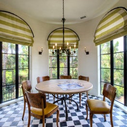 Circular Game Room with Arched Steel Windows and Eased Plaster Edges
