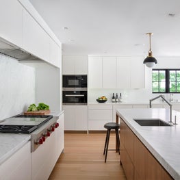 Kitchen with island and large marble slabs