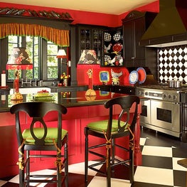 This bright inviting kitchen boasts colors of ripe fruits and vegetables. 