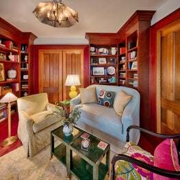 A conglomeration of soft colored materials and patterns creates a warm milieu.