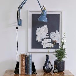 Interior Vignette with Industrial Sconce & Burl Wood Casepiece
