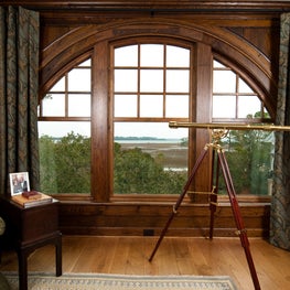 Home Office with Arched Window, Walnut Paneling and a Beautiful River View