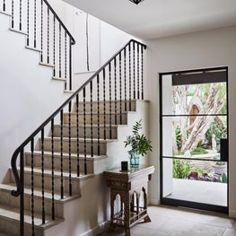 stairs with French limestone and custom design railing.