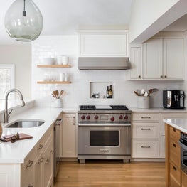 Warm white kitchen w/ Cesarstone quartz, oak island, hand made subway tile