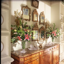 Antique French enfilade with collection of French mirros. 