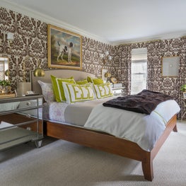 Master Bedroom with Mirrored Nightstands, Brown Wallpaper and Lime Green Accents