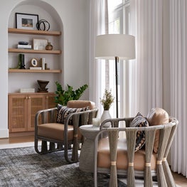 Subtle architectural arches and warm wood inclusions set the tone for a casual yet sophisticated family room.