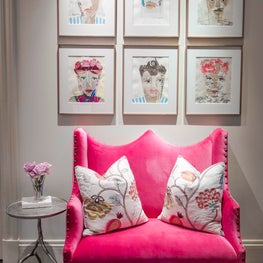 Modern girls sitting area with portrait collage & velvet settee in bold colors