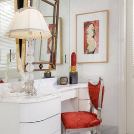 Dressing table in master bath with a striking touch of red