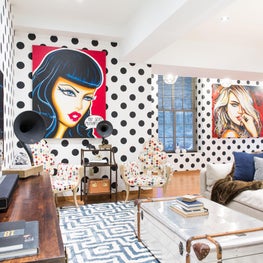 Oversized pop art mixed with pattern and color create an intense but homey space