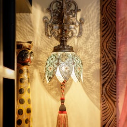 Moroccan wall sconce in wine cellar