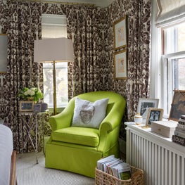 Brown Wallpaper with Matching Draperies and Green Upholstered Chair 